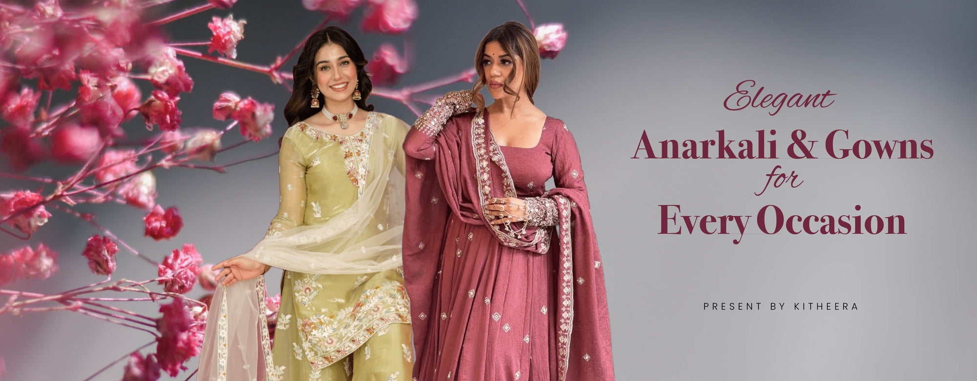 two women wearing traditional embroidered Anarkali dresses and gowns in pastel green and rose pink, set against a soft floral background with cherry blossoms, promoting stylish ethnic wear for every occasion.